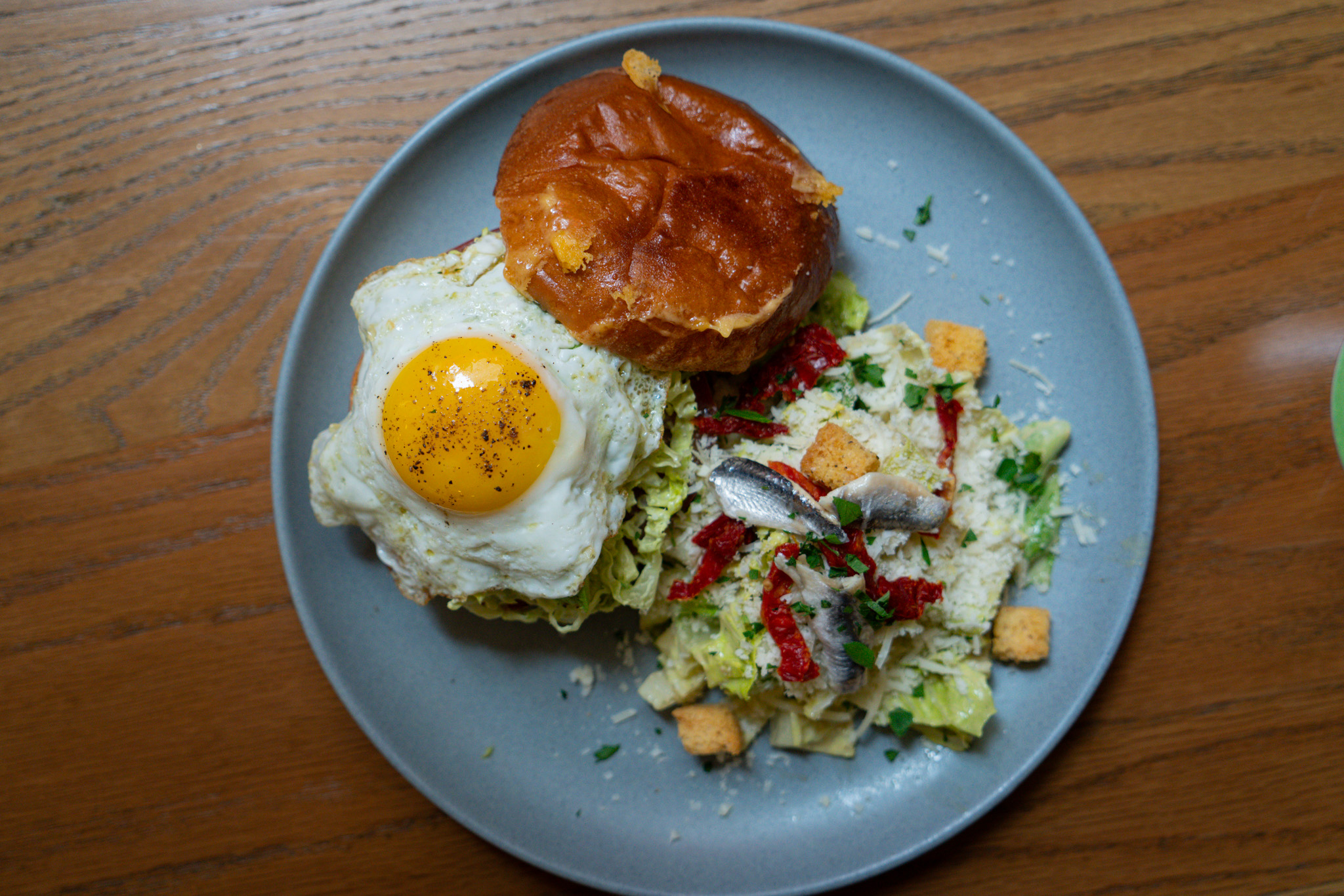 Breakfast sandwich, egg, and salad served at The Bank Café