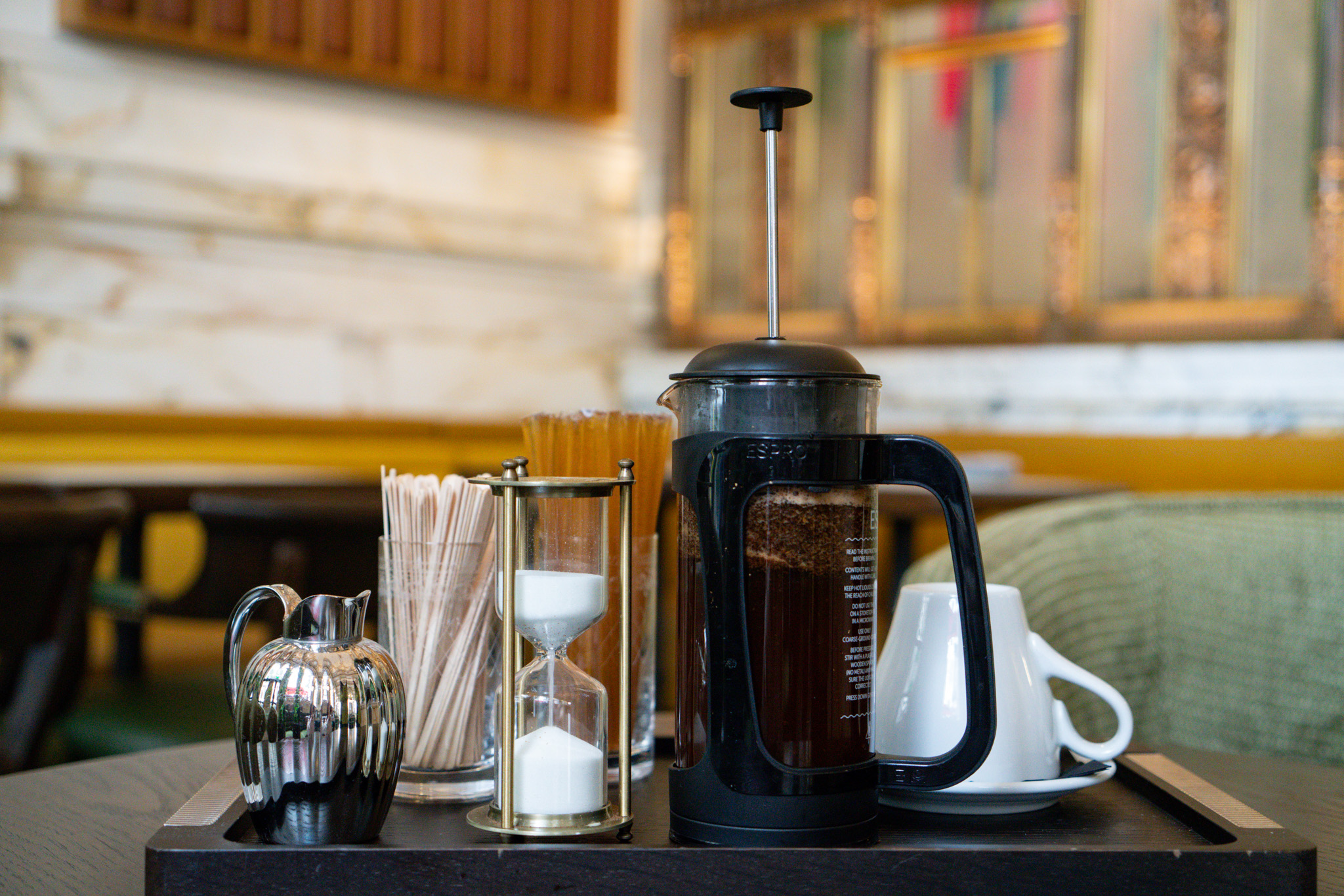 Freshly brewed coffee press and café service