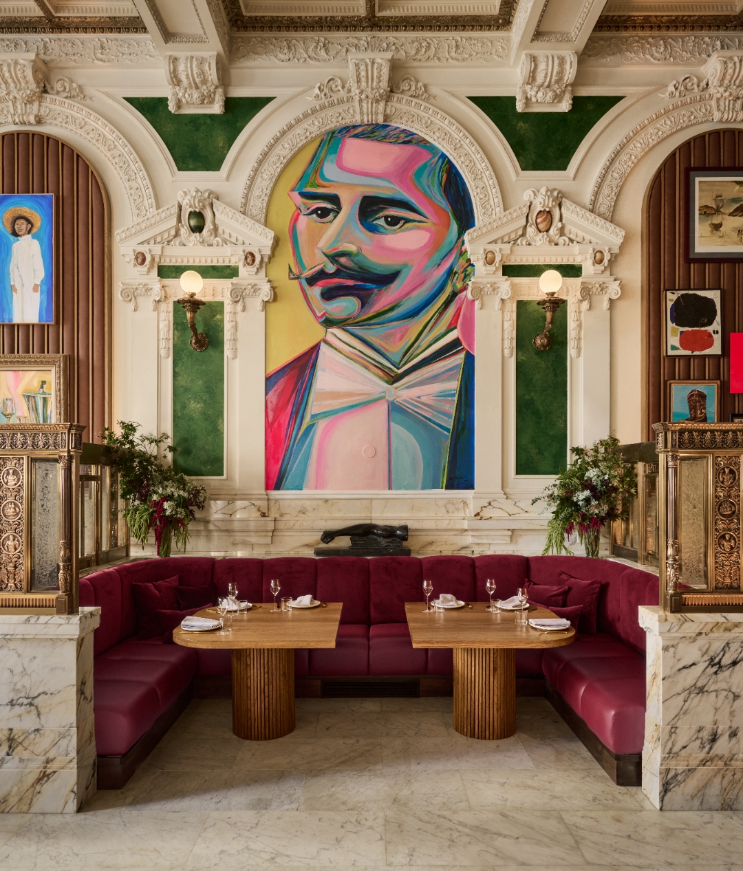 Colorful mural and dining banquette at The Bank Café